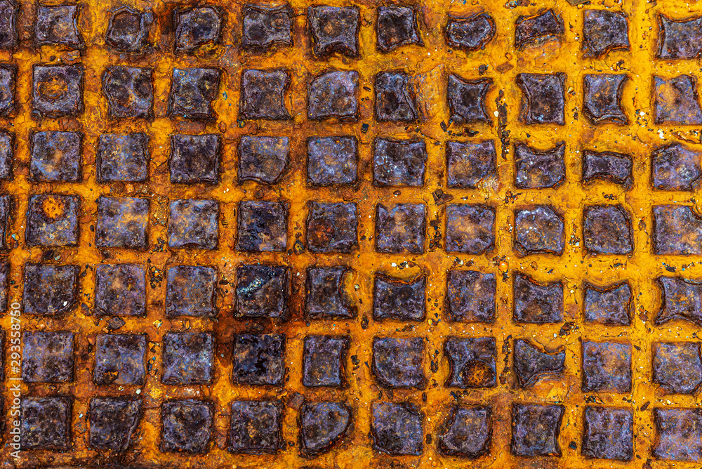 Old rusty metal surface with square shapes