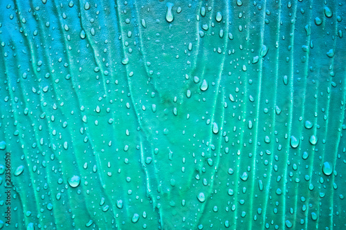 Rain drops on colorful wooden planks © beerphotographer