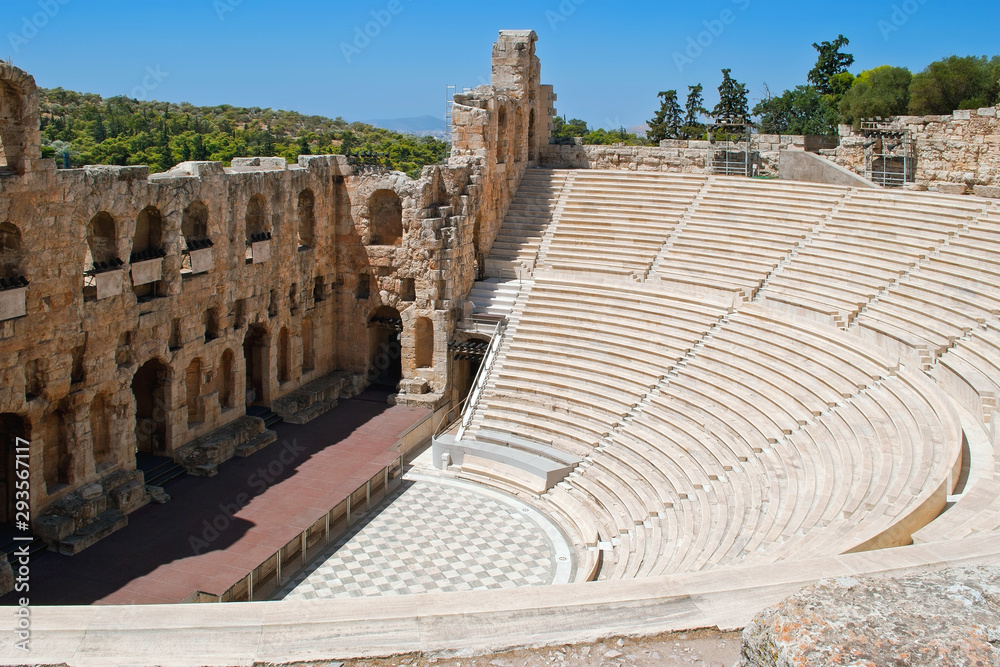 View of the stage of the ancient theater in the territory of the Acropolis in Athens on a bright sunny day.