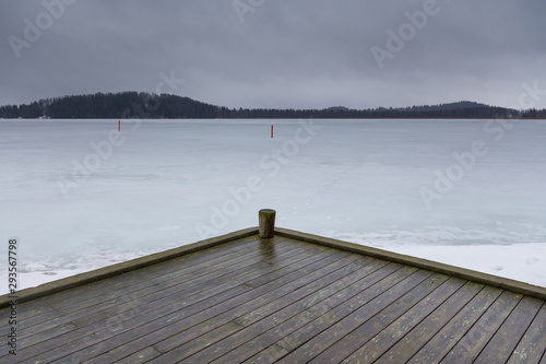 View of the frozen Iso Tilijarvi lake in Hollola, Finland. photo