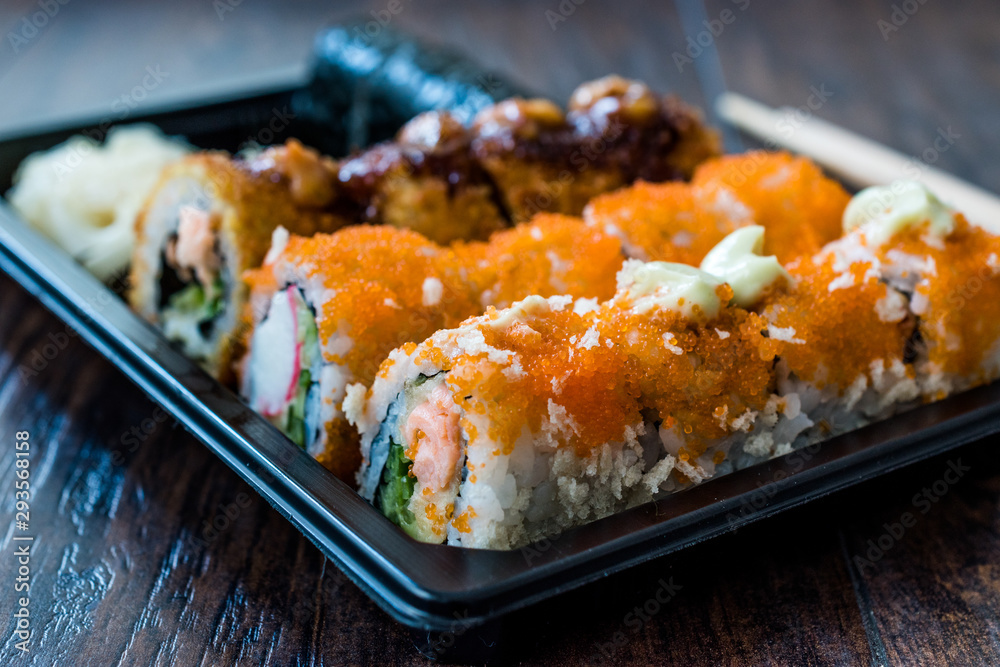 Sushi Set in Plastic Container Box / Package. California Roll, New York Roll, Boom Roll, Ginger, Wasabi and Soy Sauce. Sushi Set in Plastic Container Box / Package. California Roll, New York Roll, Boom Roll, Ginger, Wasabi and Soy Sauce.