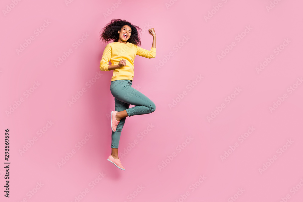 Full body photo of emotional enthusiastic cheerful expressing triumph having nice mood hipster jumping up waiting for prize wear yellow sweater pants isolated pastel color background