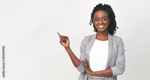 Black Business Lady Pointing Finger At Empty Space On White