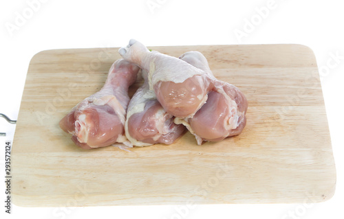 Raw chicken  on cutting board on white background
