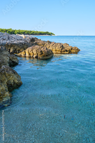 Fototapeta Naklejka Na Ścianę i Meble -  Crystal clear blue green Adriatic sea and a rocky beach on the island Krk, Croatia,