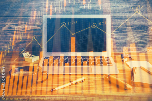 Double exposure of forex graph and work space with computer. Concept of international online trading. © peshkova
