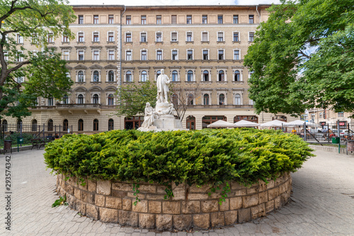 Budapest, Hungary - October 01, 2019: Mother, Child and Rescuer - Statue of doctor Ignac Semmelweis in front of Rokus Hospital. The statue is by Alajos Strobl (1906). photo