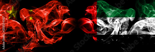 China vs United Arab Emirates, Emirati smoke flags placed side by side. Thick colored silky smoke flags of Chinese and United Arab Emirates, Emirati