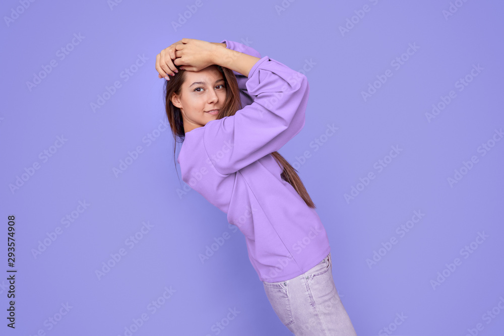 Stylish woman touching hair and bending back Stylish woman touching hair and bending back
