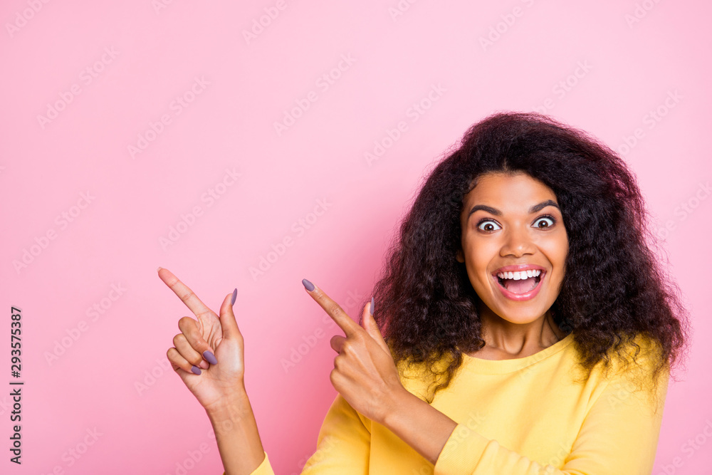 Close up photo of funny shocked african girl promoter enjoy ads recommend black friday pick tips point index finger wear index finger wear yellow sweater isolated over pastel color background Close up photo of funny shocked african girl promoter enjoy ads recommend black friday pick tips point index finger wear index finger wear yellow sweater isolated over pastel color background
