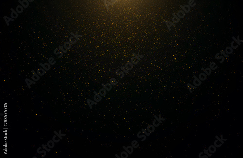 Abstract background of flickering gold particles and light flare photo