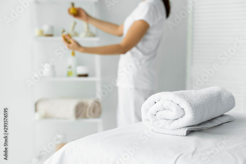 selective focus of white towel on massage mat in spa