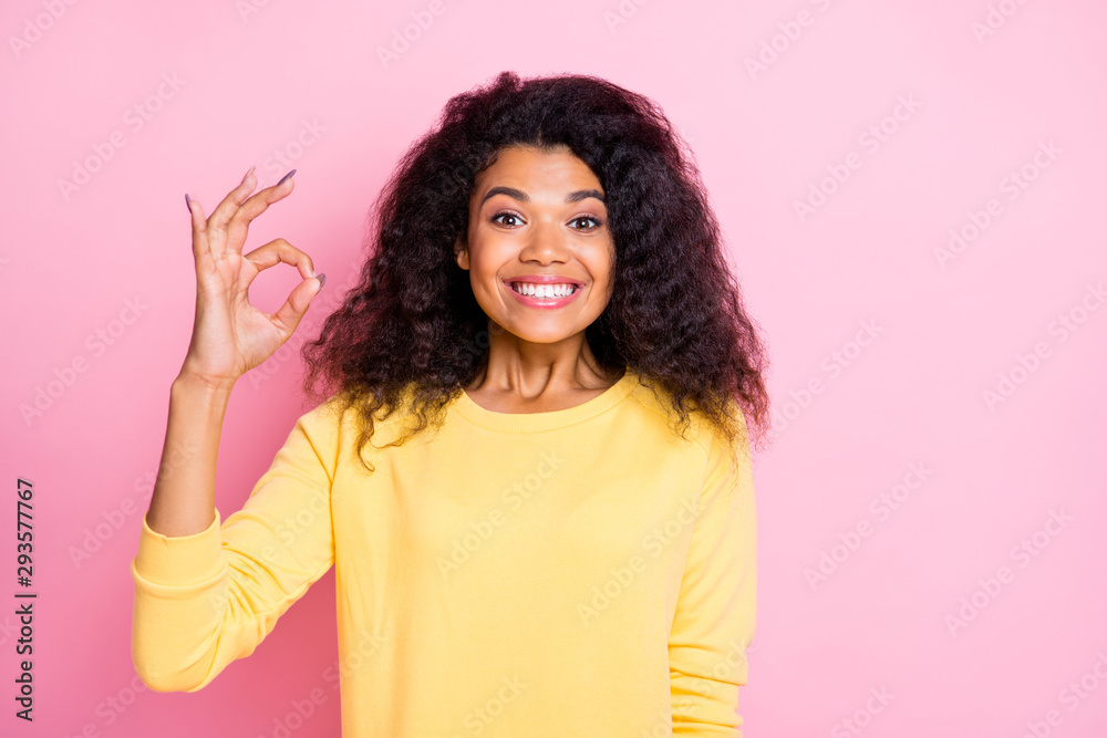Portrait of positive cheerful african girl show ok sign recommend ads promo present choice decision advice wear yellow good look outfit isolated over pastel color background Portrait of positive cheerful african girl show ok sign recommend ads promo present choice decision advice wear yellow good look outfit isolated over pastel color background