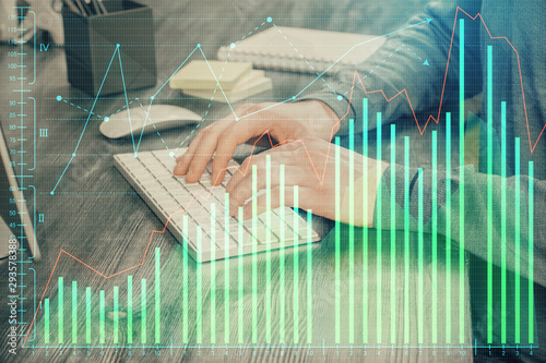 Multi exposure of financial graph with man works in office on background. Concept of analysis. © peshkova