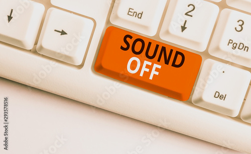 Writing note showing Sound Off. Business concept for To not hear any kind of sensation produced by stimulation White pc keyboard with note paper above the white background photo