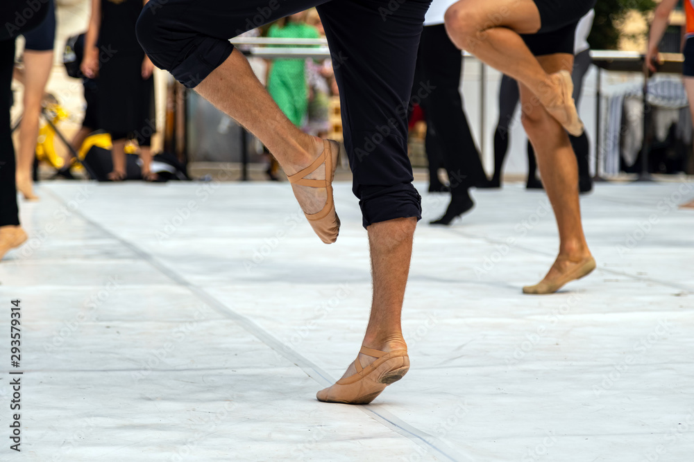 Ballet dancers practicing performance outdoors. Close up of