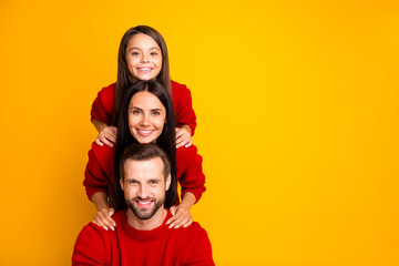 Photo of cheerful funky cute fascinating family forming pyramid creating construction empty space next to mommy daddy day with daughter isolated over vivid color yellow background