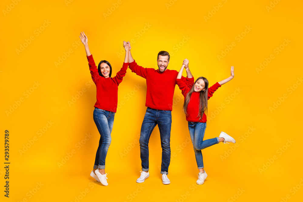Full length body size photo of rejoicing screaming cheerful positive friendly family loving each other with emotional facial red sweaters expression isolated over vivid color yellow background