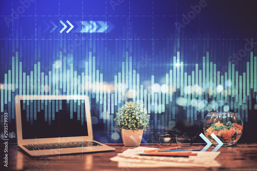 Forex graph hologram on table with computer background. Double exposure. Concept of financial markets.