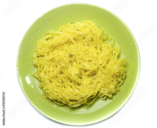 yellow noodles on dish isolated on white background