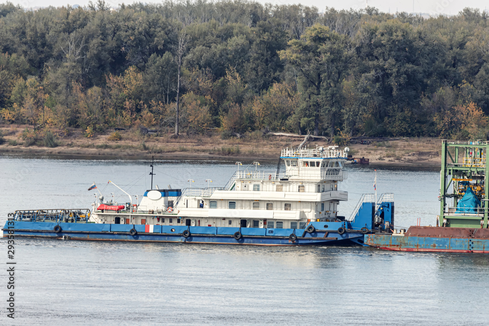 River tug without cargo floating on river