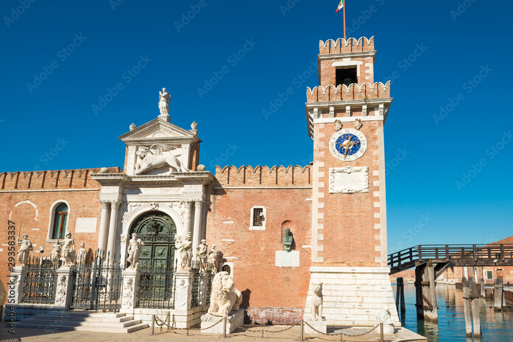 Entrance to Venetian Arsenal with clock and towers. Venice, Italy