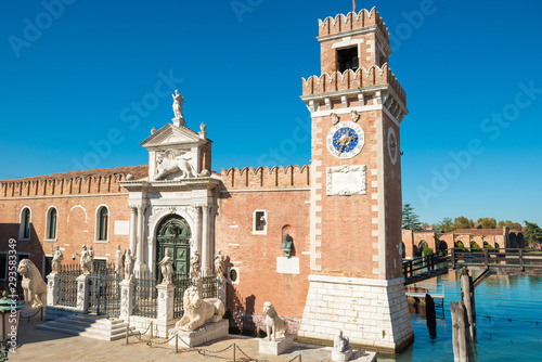 Entrance to Venetian Arsenal with clock and towers. Venice, Italy