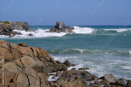 Rocks and stormy sea at Cozy Nook Bay, Southland, New Zealand
