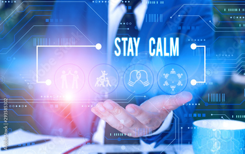 Text sign showing Stay Calm. Business photo showcasing Maintain in a state of motion smoothly even under pressure Male human wear formal work suit presenting presentation using smart device