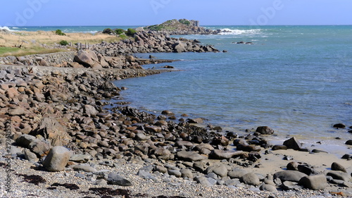 Rocks and bay at Cozy Nook, Southland, New Zealand photo