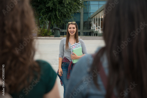 Female friends in front of a University campus
