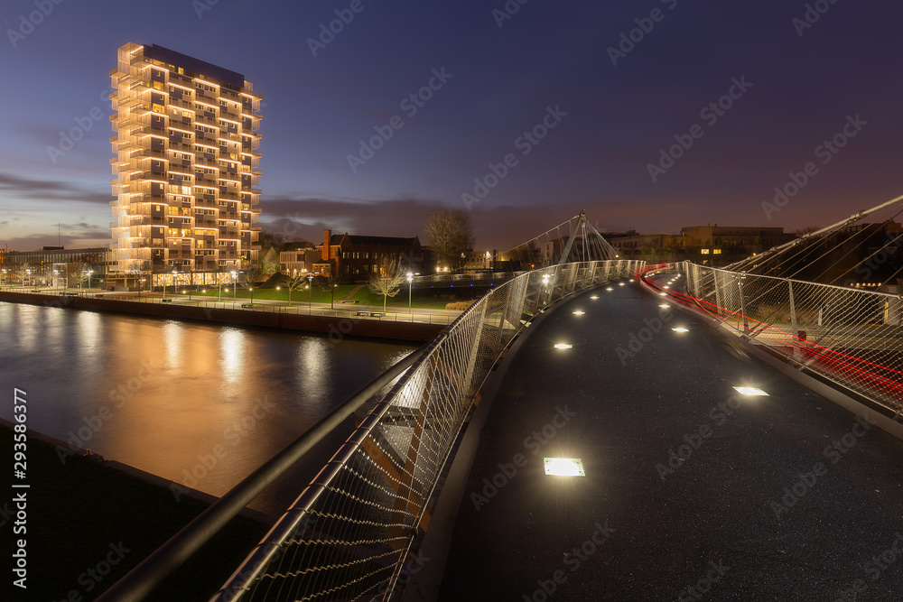 The K-tower in Kortrijk along the Leie in the evening light, Belgium The K-tower in Kortrijk along the Leie in the evening light, Belgium