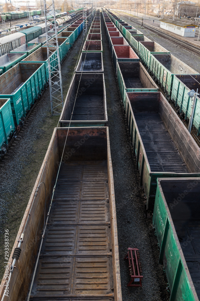 Freight cars at a large railway station. Cargo transportation and railway trains