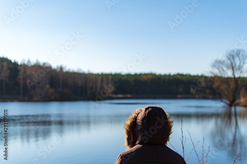 Woman overviewing a lake while autumn © Markus Schroth