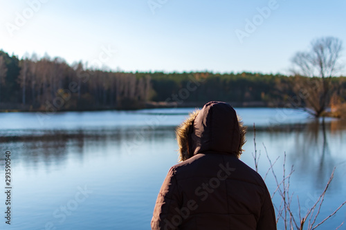 Woman overviewing a lake while autumn © Markus Schroth