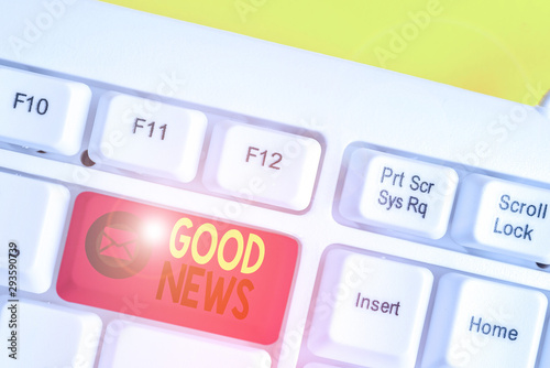 Text sign showing Good News. Business photo text Someone or something positive,encouraging,uplifting,or desirable White pc keyboard with empty note paper above white background key copy space photo