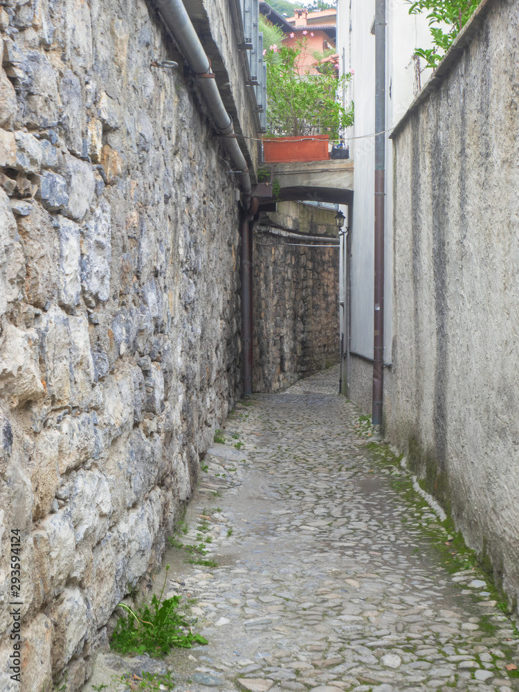 narrow and deserted street in a village, Como Lake - Italy
