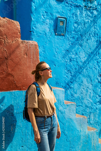Girl tourist in the famous blue city. © lizavetta