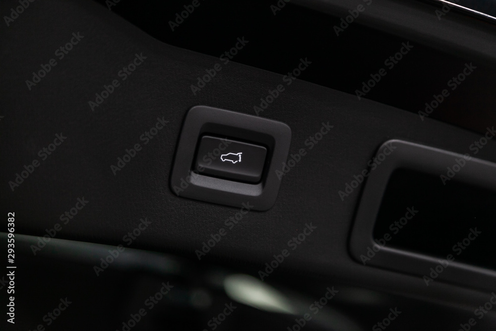 close-up of the trunk release button. modern car interior.