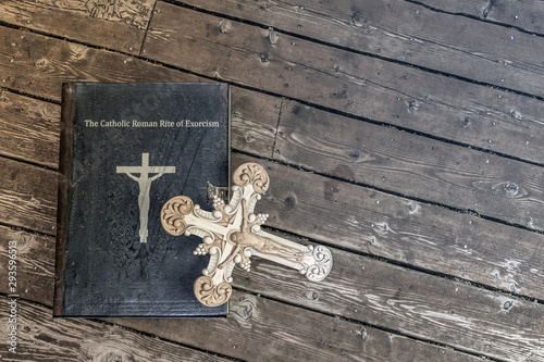 Photo exorcism book on wooden floor