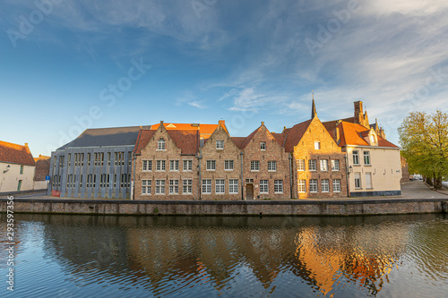 Colored romantic houses by the canal in the historic city center of Brugge