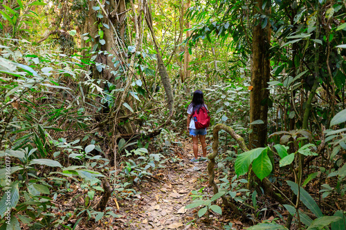 Woman trekking in Asian jungle