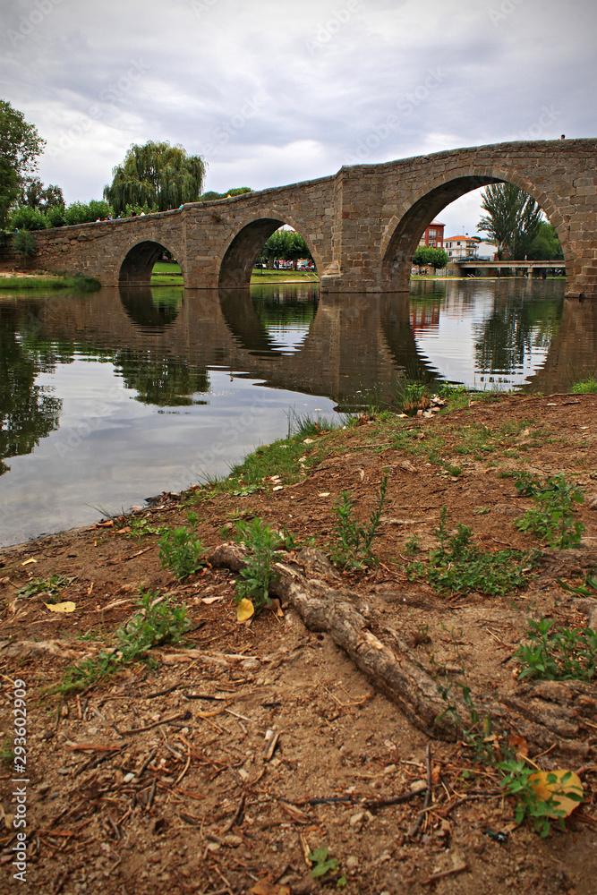 Fototapeta premium Old stone bridge over river in Spain