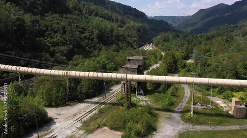 Aerial orbit to right showing coaling tower and newer coal slurry pipeline in Whitesville, West Virginia. photo