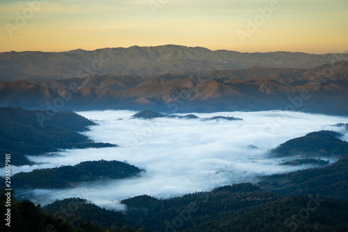 Mist landscape with mountain and sunrise