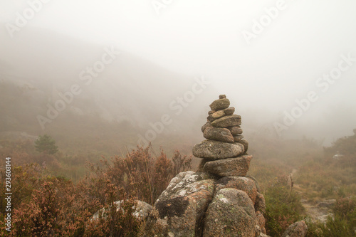 Cairn or stones pile marking a mountain trail