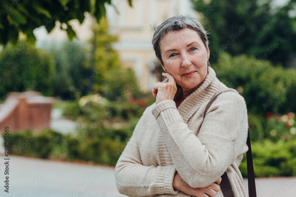 Smiling old woman portrait. anti aging concept. Portrait of a beautiful senior woman Smiling old woman portrait. anti aging concept. Portrait of a beautiful senior woman