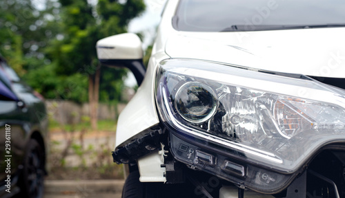 car accident damaged on the road with soft-focus and over light in the background photo