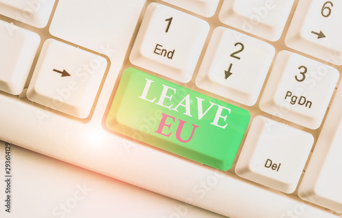 Text sign showing Leave Eu. Business photo showcasing An act of a demonstrating to leave a country that belongs to Europe White pc keyboard with empty note paper above white background key copy space photo