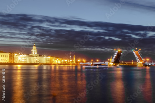 St. Petersburg morning day evening night sunset dawn during a beautiful divorced drawbridge with lights and reflection from the water of the Nevsky Palace Trinity Liteiny river photo